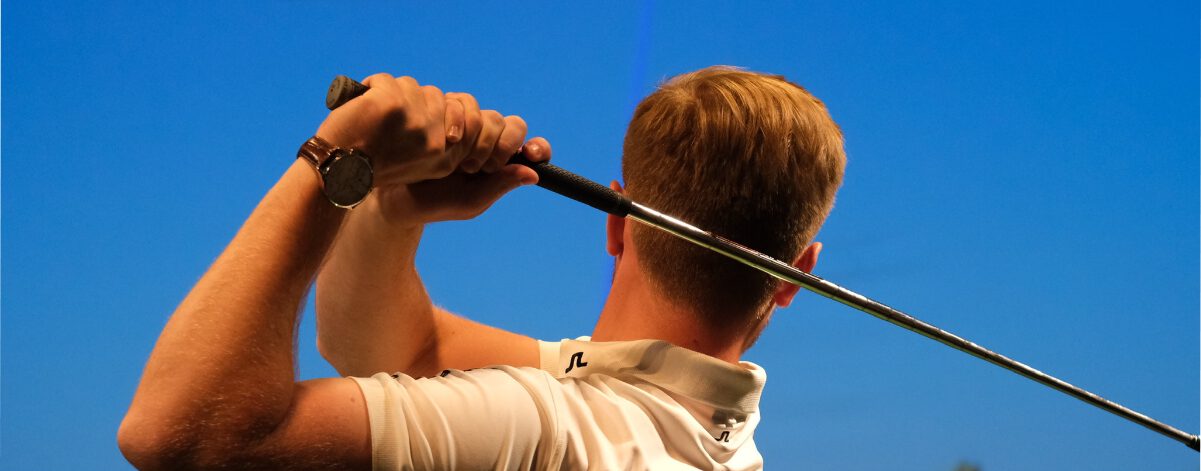 PGA Professional golf swing during a lesson demonstration